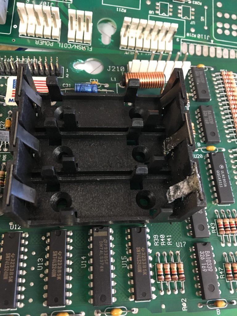 Battery holder with corrosion.
